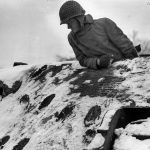 6th Armored GI Examines Hits on Tiger
