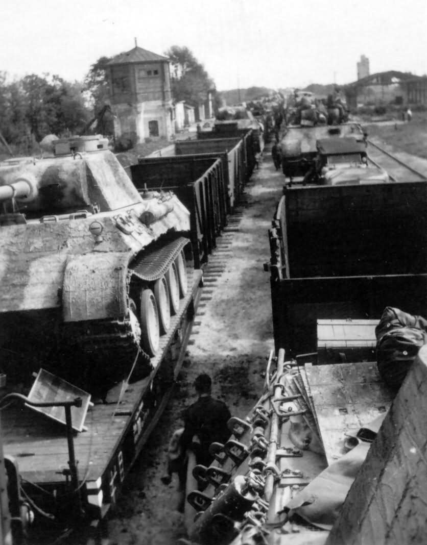 Panther Ausf D is loaded onto a flatbed railway car