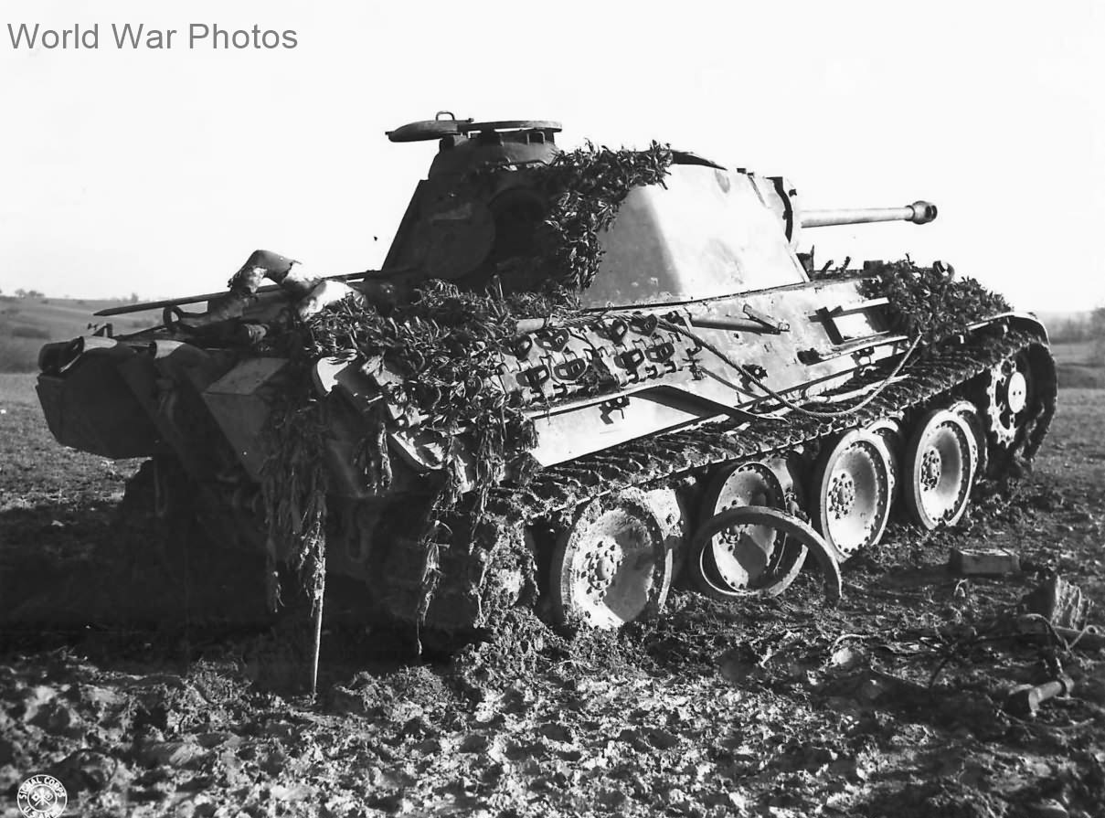 Body of German soldier atop destroyed Panther in Schalbach, France 1944