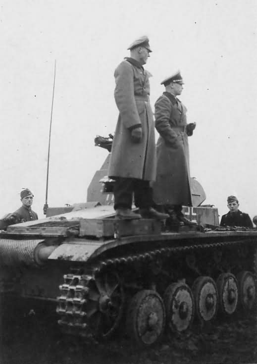 Two German officers atop a Panzer II tank