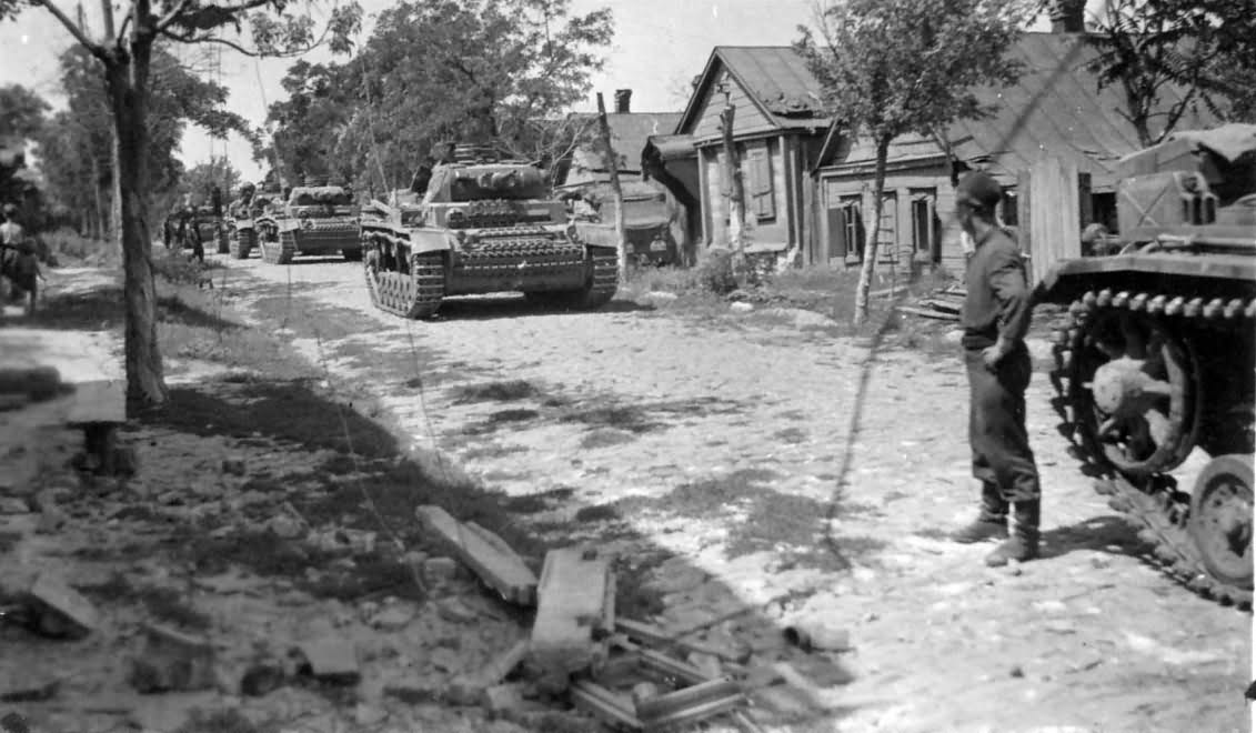 Column of Panzer III Ausf J tanks on a road in Russia