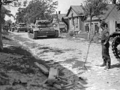 Column of Panzer III Ausf J tanks on a road in Russia