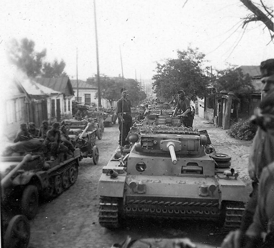 Column of Panzer III tanks on a road in Russia