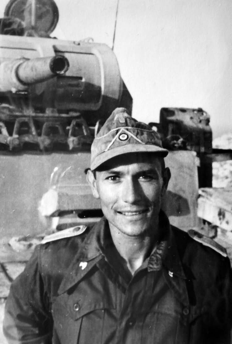 German soldier posing in front of Panzer III from Panzer Regiment 8 DAK