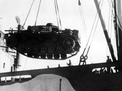Panzer III tank being loaded into a ship DAK