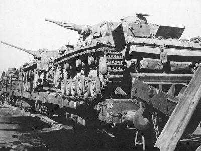 Panzer III tanks being transported on rail cars