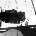Panzer III tank being loaded into a ship DAK