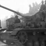 German infantry and tankers ride a Panzer IV