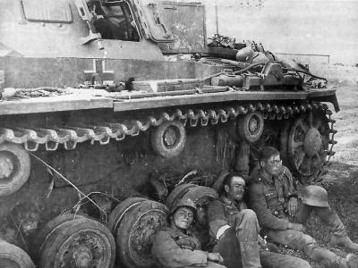 German soldiers resting next to a Panzer III