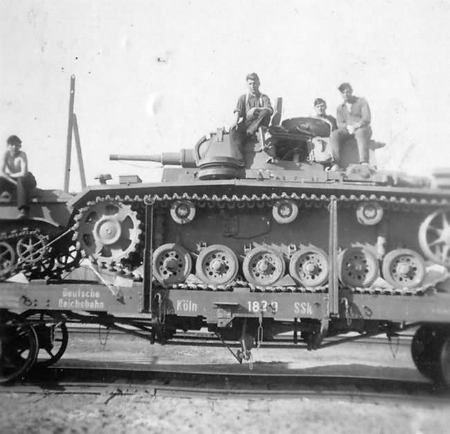 Panzer III on railroad flat car in transit to the front
