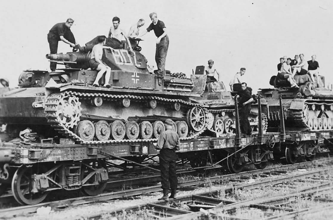 Panzer IV code 802 loaded onto a flatbed railway car