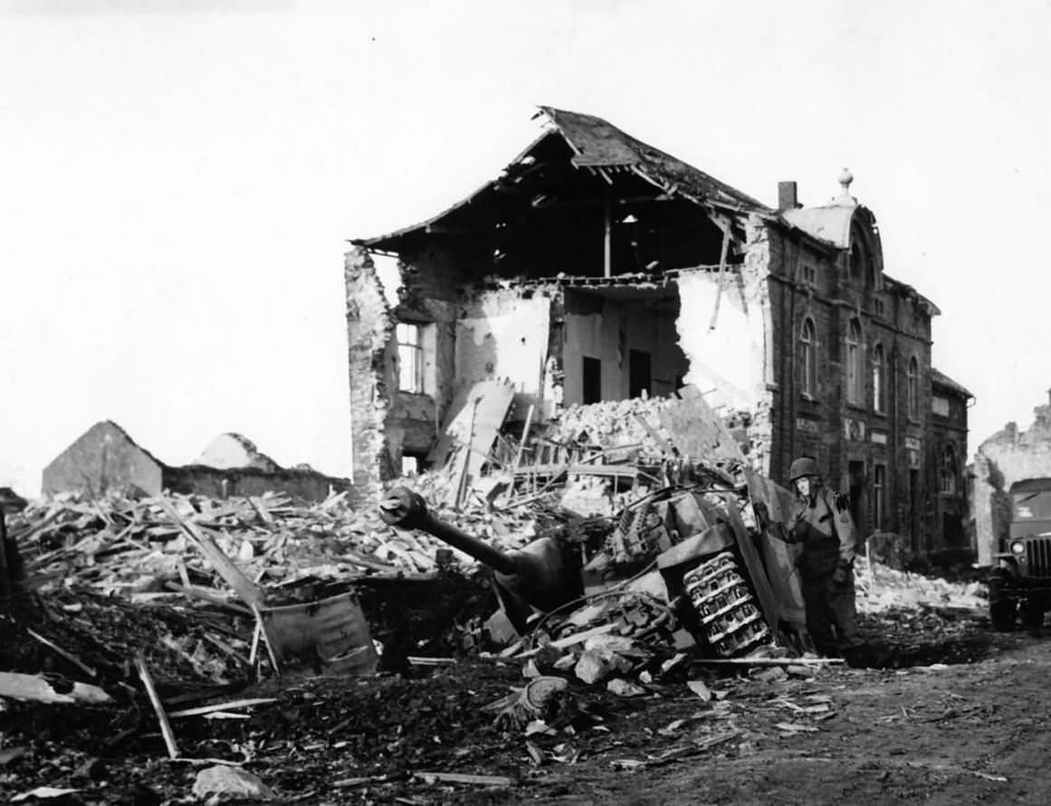 Soldier by Wreckage of German StuG 40 ausf G in Noville 1944