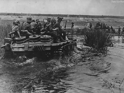 Camouflaged German troops atop StuG III Operation Barbarossa