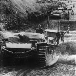 StuG III leading a long column of troops and vehicles somewhere on the Eastern Front
