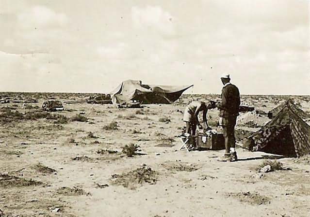 German afrika korps troops by tent in desert