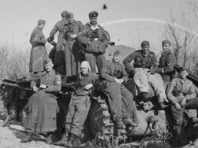 A group of Waffen-SS soldiers posing with a captured KV-1