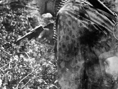 Soldier advances with pistol ready on Russian Front 1941