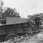 Semovente da 47/32 loaded in the bed of a truck