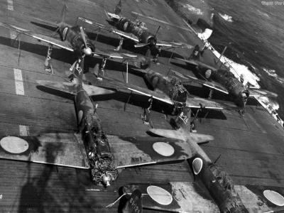 USS Copahee with lineup of Mitsubishi A6M5 model 52