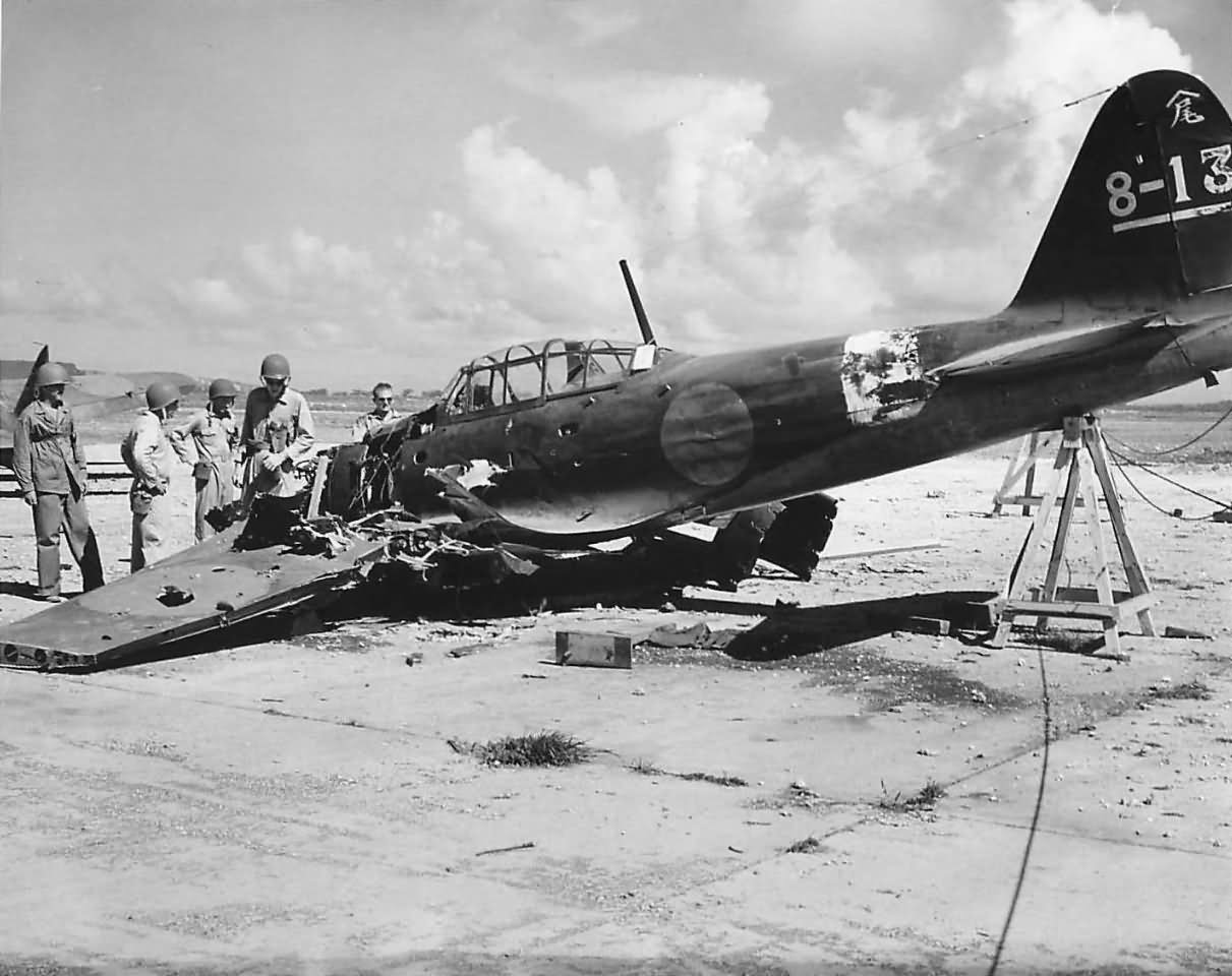 US troops inspect the wreckage of A6M5 Zero code 8-13 on Saipan