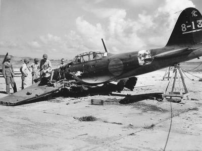 US troops inspect the wreckage of A6M5 Zero code 8-13 on Saipan