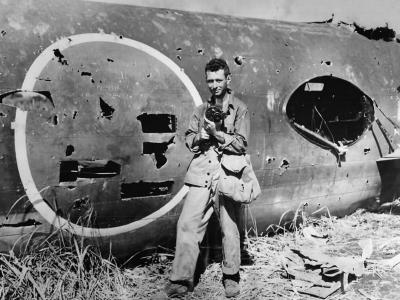 Mitsubishi G4M wreck and Marine photographer