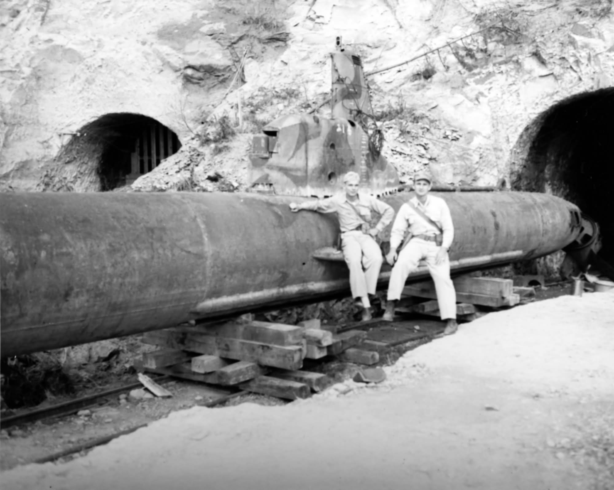Kairyu Type submarine outside its cave hideaway in a Japanese coastal hillside Sept 1945