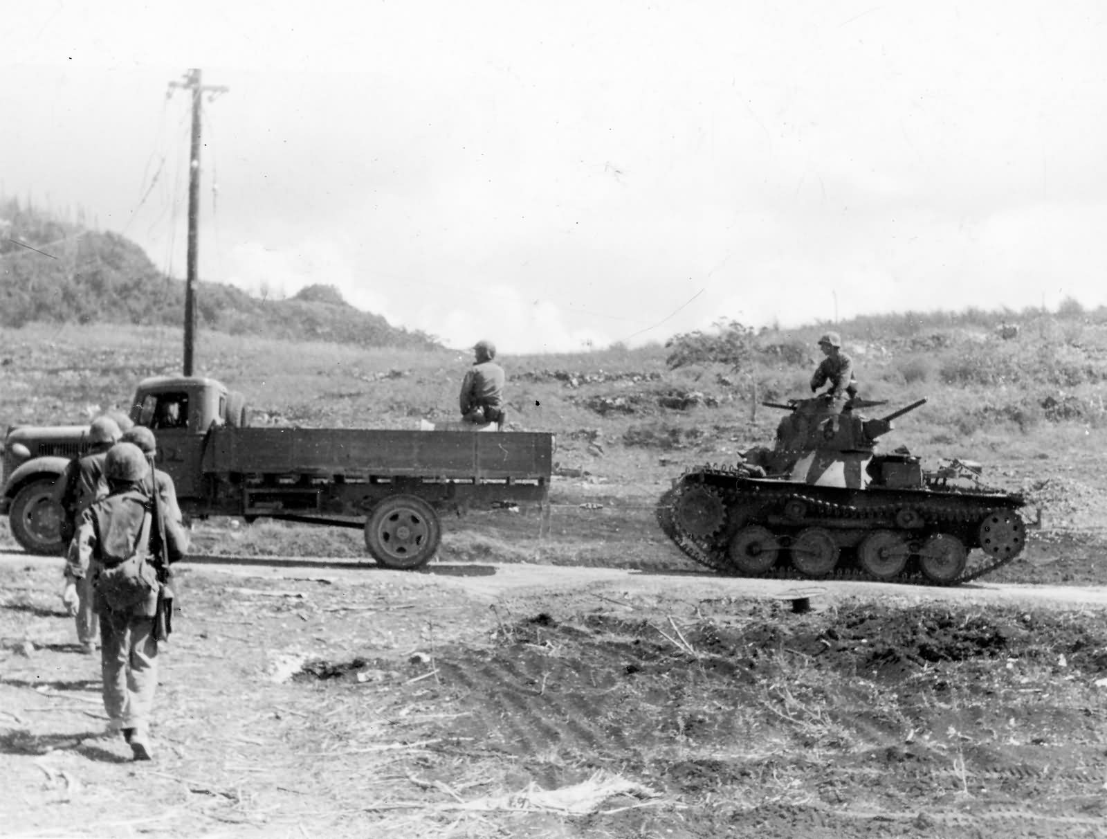 Marines Use Captured Japanese Truck to Tow Type 95 Ha Go Light Tank Saipan 1944