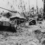 US Troops in jungle with Knocked Out Japanese tank Ha-Go