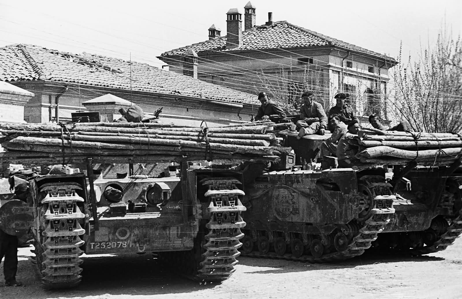 Flame throwing tanks Churchill Mk VII Crocodiles wait in Granarolo dell’Emilia Italy April 1945
