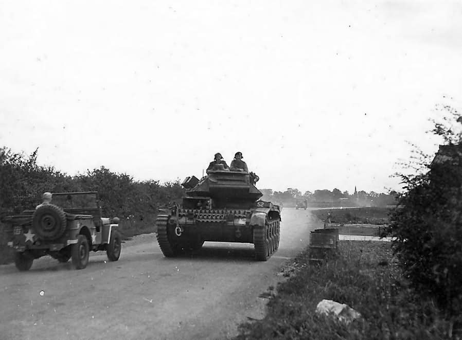 Crusader tank moving on country road England