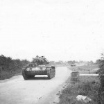 Crusader tank moving on country road England photo