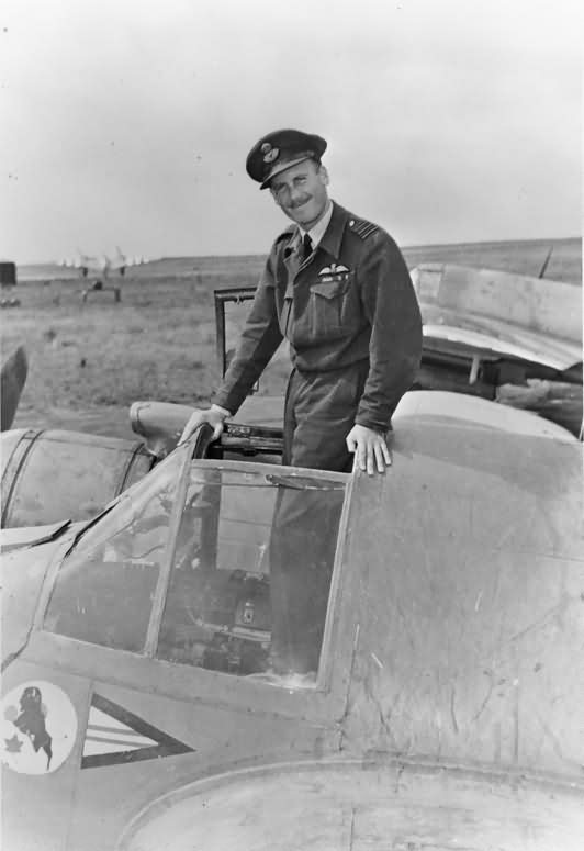Wg Cdr A. K. Gatward commander of No 404 Squadron RCAF standing in the cockpit of his Beaufighter TF Mk X at Davidstow Moor