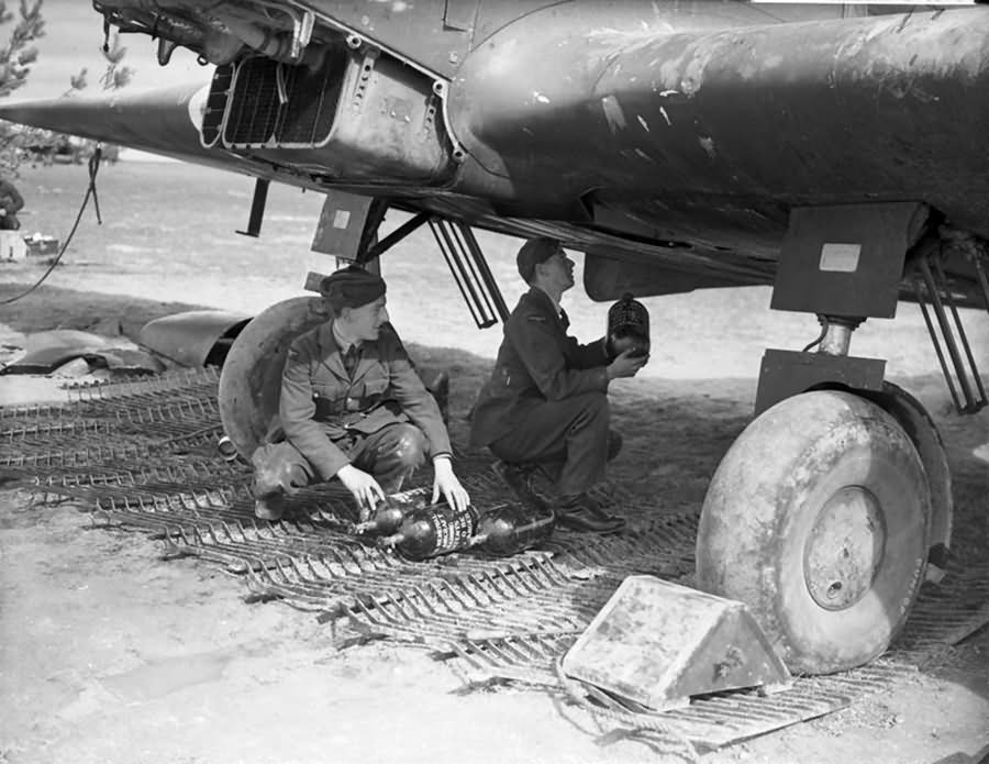 Airmen loading fresh oxygen cylinders into a Battle of No. 226 Sqn RAF at Reims Champagne