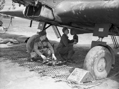 Airmen loading fresh oxygen cylinders into a Battle of No. 226 Sqn RAF at Reims Champagne