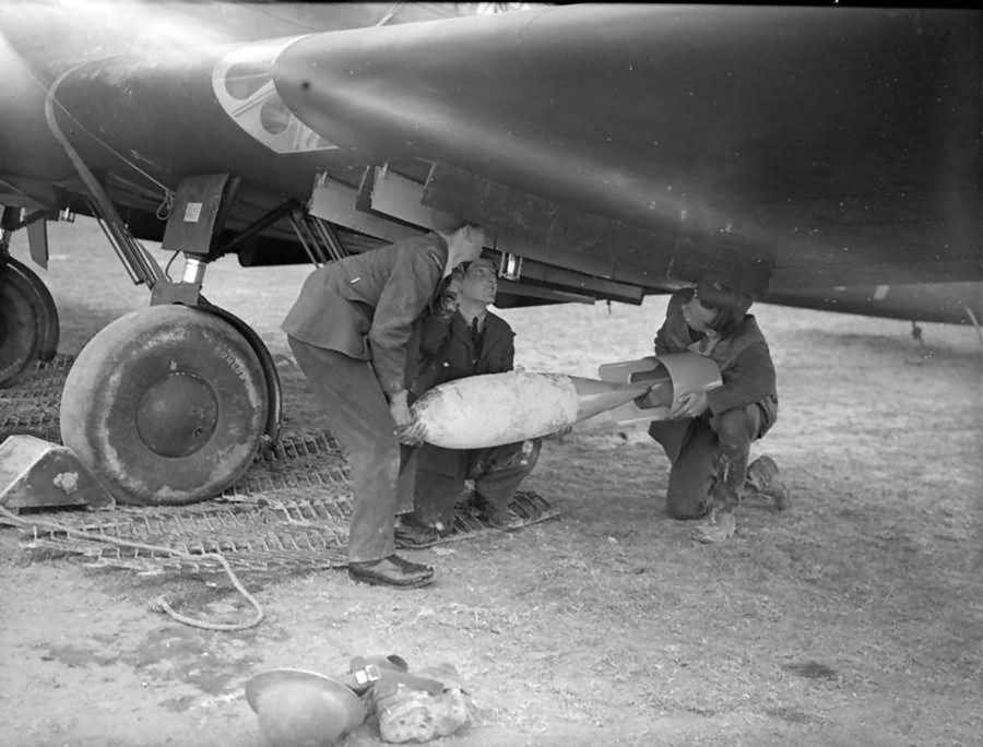 Armourers load a bomb into the Battle of No. 103 Squadron RAF at Betheniville