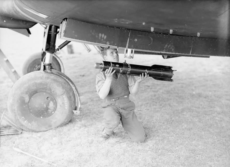 Armourer loads a 4.5 inch reconnaissance flare into the Battle of No. 218 Sqn at Auberives-sur-Suippes