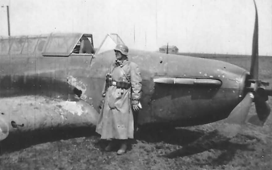 wehrmacht soldier next to a Fairey Battle