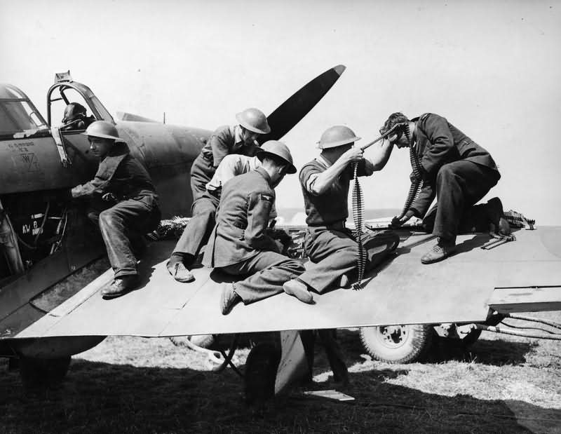 Ground staff re arm a Hurricane Mk I of No 32 Squadron at Biggin Hill August 1940