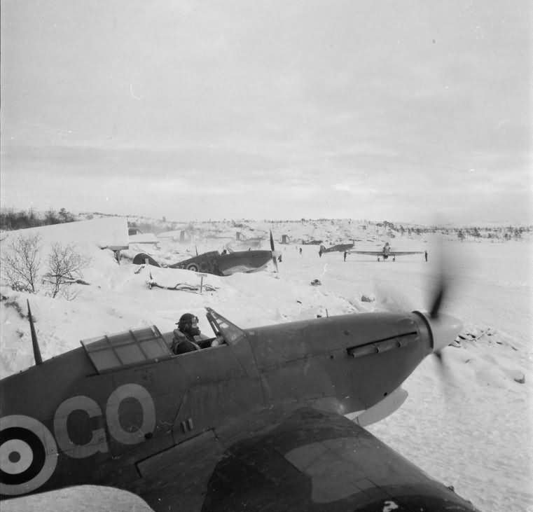 Hurricane Mk IIB of No 134 Squadron RAF scramble from their dispersals in the snow at Vaenga, Russia