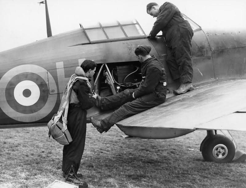 Hurricane pilot and ground staff inspect the oxygen supply of the aircraft before a sortie October 1940
