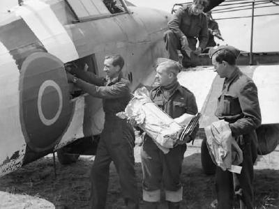 Mail being loaded into a Hurricane Mk IIC of No 1697 Air Despatch Letter Service Flight at B2 Bazenville Normandy 1944