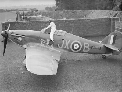 PO Clowes of No 1 Squadron RAF climbing into his Hurricane Mk I P3395, code JX-B in a revetment at Wittering