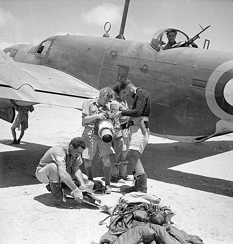 Crew of a Martin Maryland of No 39 Squadron RAF unship a Type F.24 aerial camera