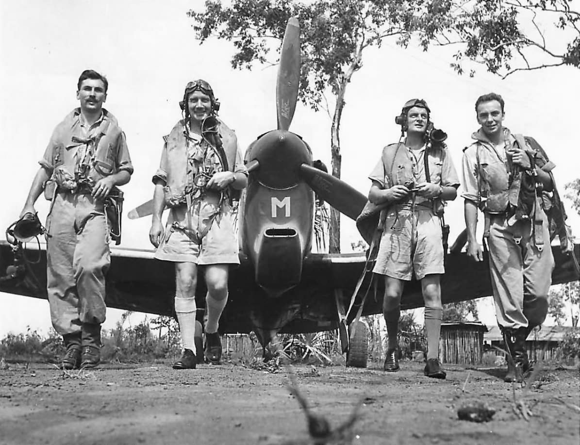 RAF No. 54 Squadron Leader E.M. Gibbs with pilots Cavanagh, Norwood and Thompson with Spitfire Mk Vc in Australia