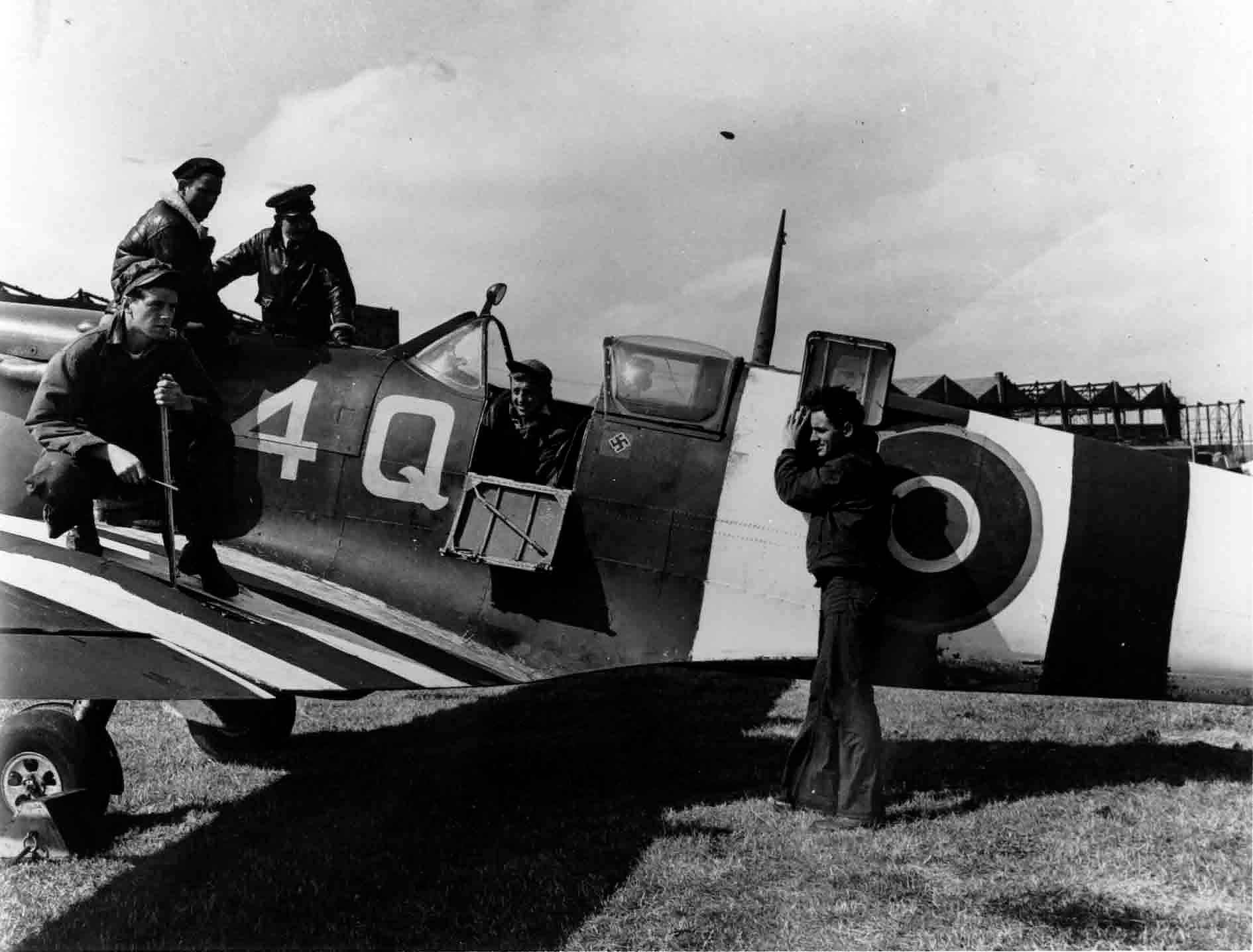 VCS-7 ground personnel with one of the Spitfires flown by the squadron during its support of the invasion of Normandy