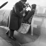 Group Captain A.G. Malan on the wing of Squadron Leader Hugo Armstrong’s Spitfire Mk IX at Biggin Hill, 2 January 1943