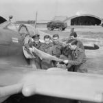 Pilots of No 132 Squadron RAF with their Squadron Leader Alan Page. Spitfire LF Mk IX at Ford, 27 April 1944