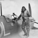 Pilot Sgt. E. J. Nowakiewicz of No. 302 Polish Squadron and his Spitfire WX-L at RAF Exeter, November 1941