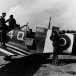 VCS-7 ground personnel with one of the Spitfires flown by the squadron during its support of the invasion of Normandy